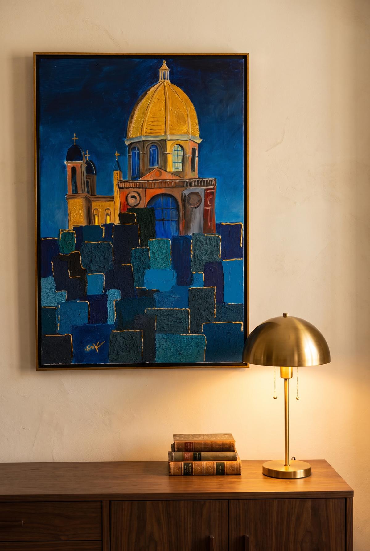 Focal Point of Existence hanging above a walnut console with a brass lamp