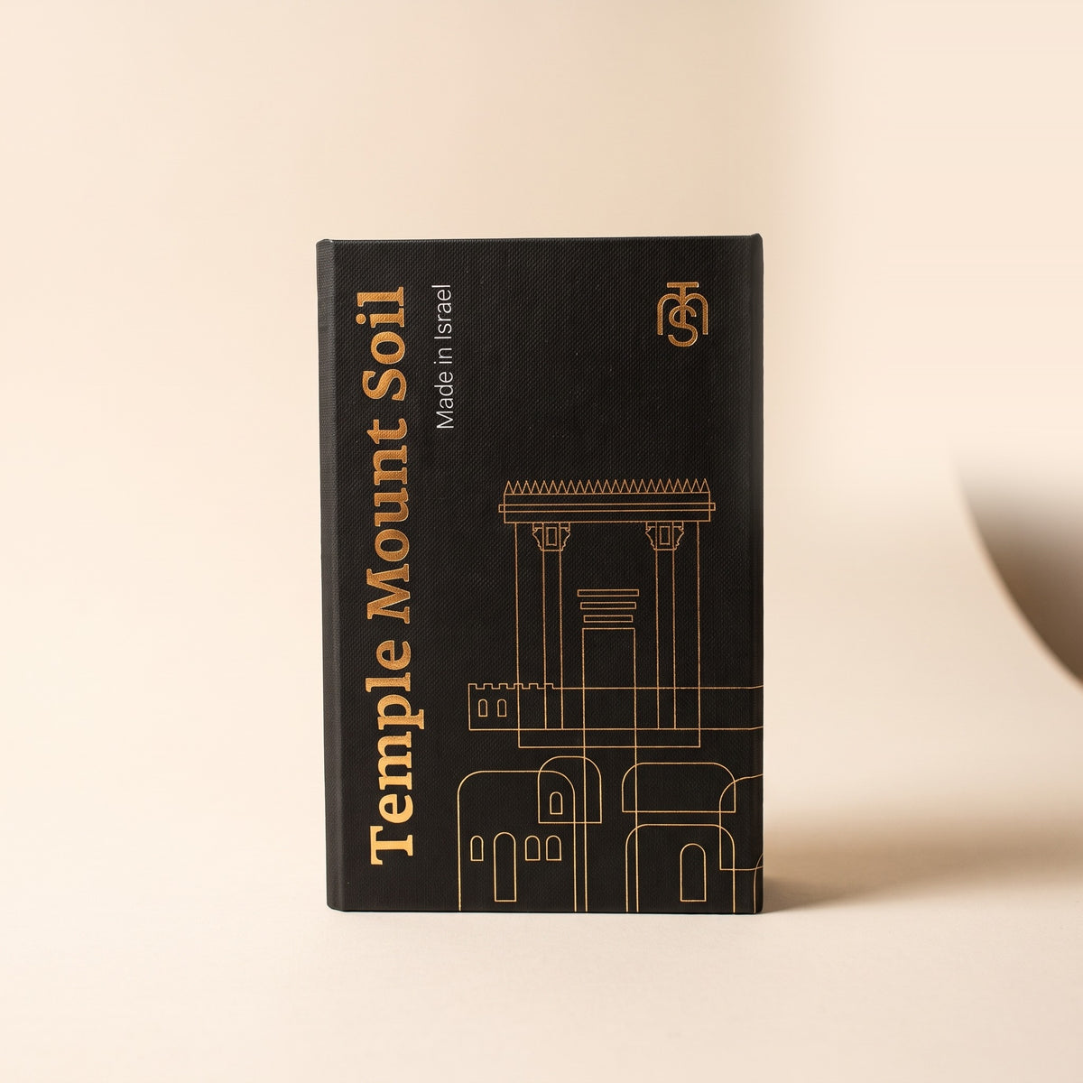 The closed black Temple Mount Soil presentation box with gold foil lettering and a Second Temple line drawing