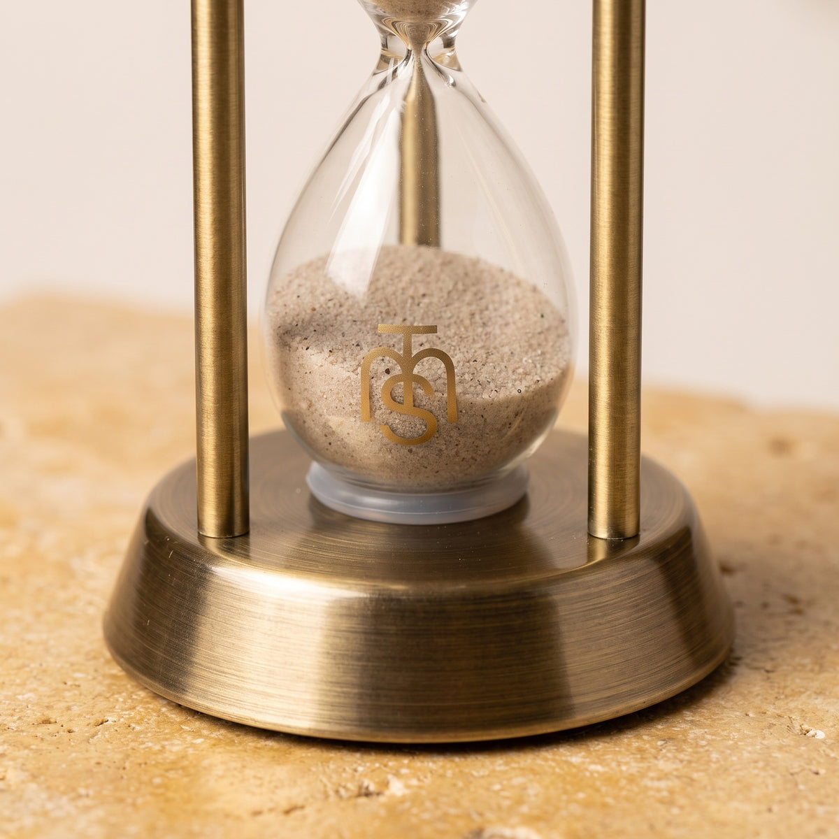Close-up of the lower bulb showing the fine Temple Mount soil and the gold Temple Mount Soil monogram on the glass