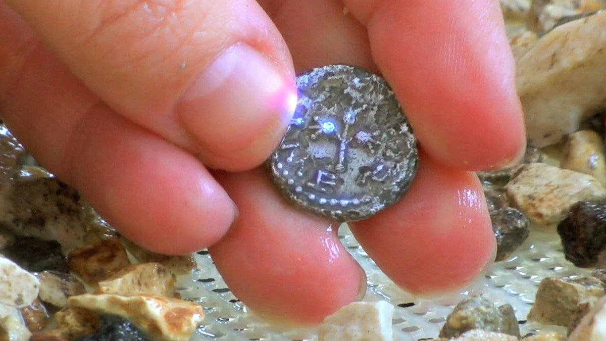 A coin found on the wet screen