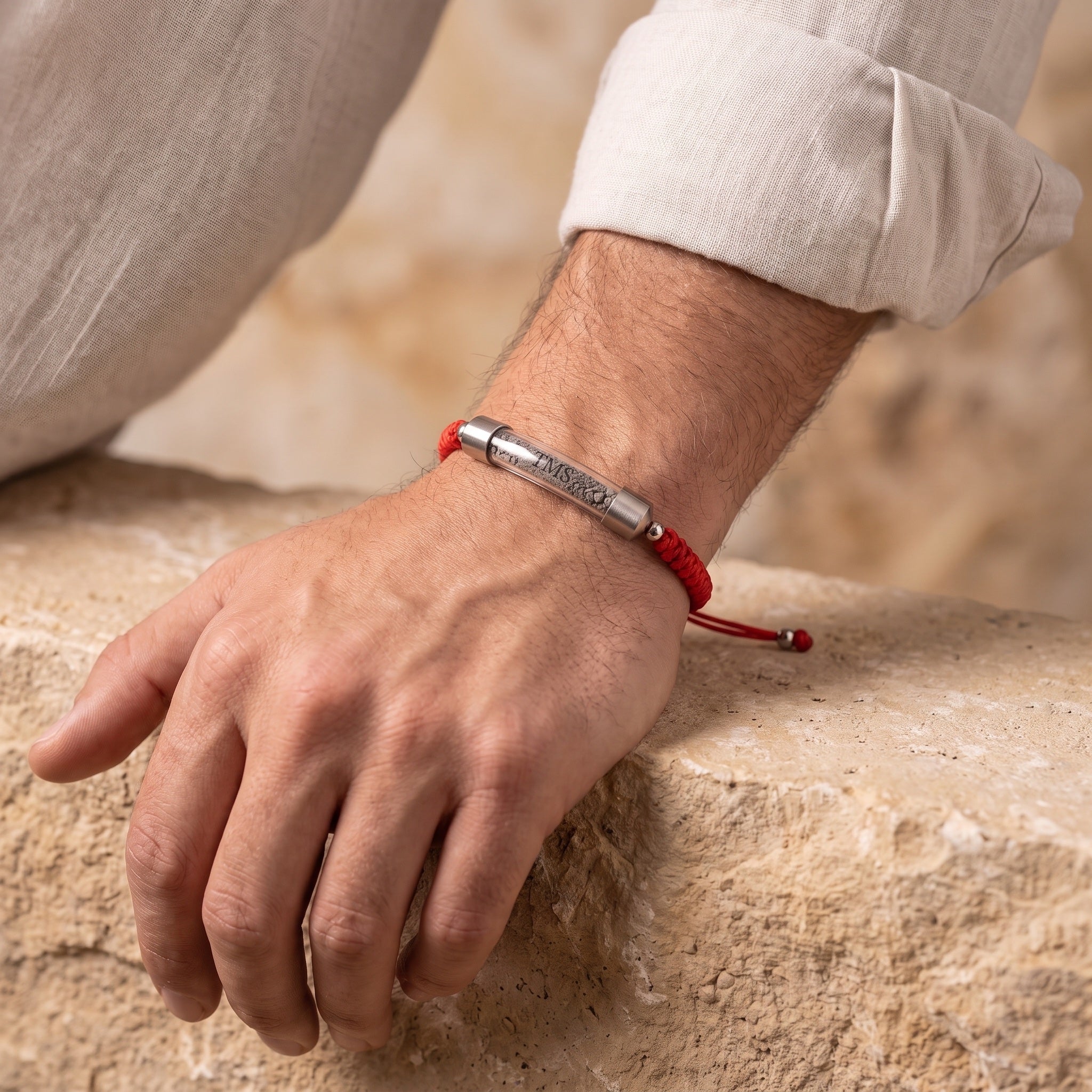 Red Covenant Soil Bracelet worn on a man's wrist