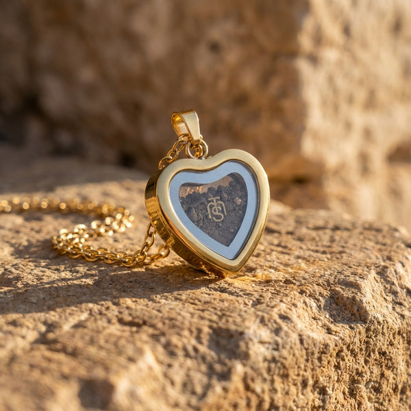 Gold heart locket holding Temple Mount soil