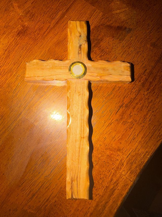 Customer photo of the cross on a wooden table
