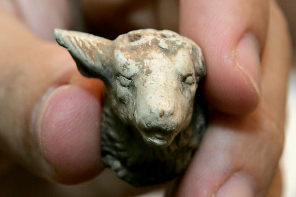 Clay ram's head ornament