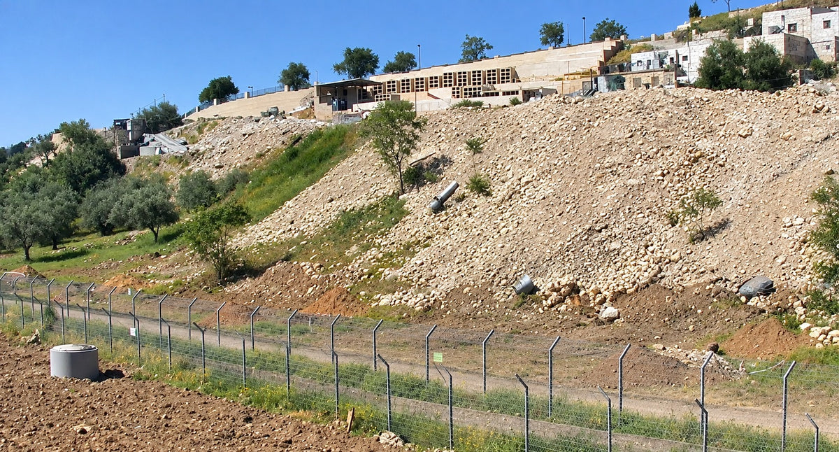 The soil heaped on a slope in the Kidron Valley