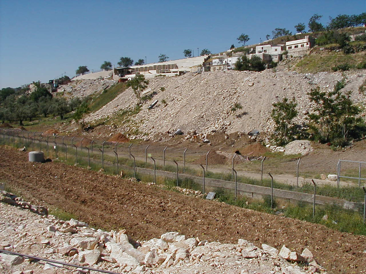 The soil heaped on a slope in the Kidron Valley