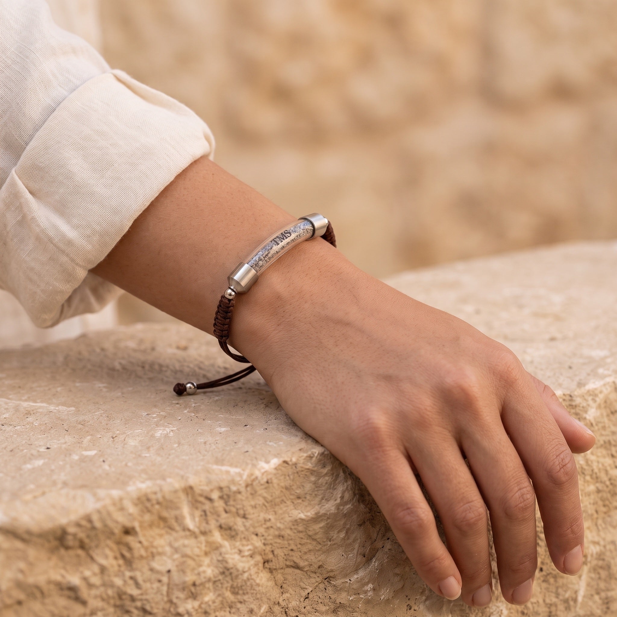 Brown Covenant Soil Bracelet worn on a woman's wrist